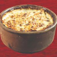 Macaroni Bechamel · A seasoned ground beef mixture between two layers of penne pasta smothered in a creamy bacha...