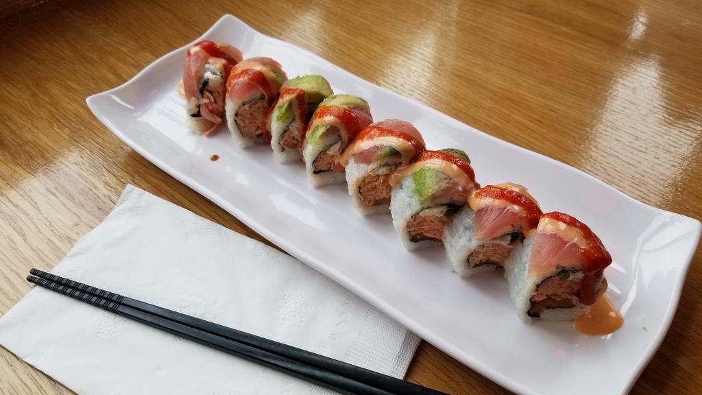 Full Monty · Spicy crab, jalapeno, salmon, cream cheese topped with tuna, avocado.