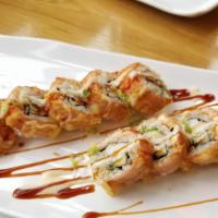 Golden California Roll · California roll topped w/ salmon and soy bean paper.