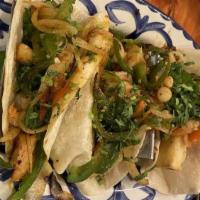 Seafood Tacos · Three flour tortillas filled with scallops & shrimp cooked with onions, tomatoes, bell peppe...