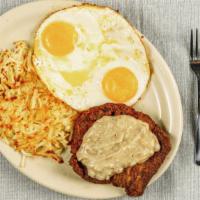 Country Fried Steak · Golden fried steak with gravy and served with two eggs.