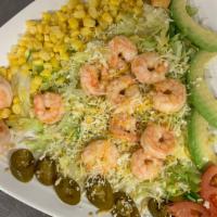 Shrimp Taco Salad · Served in a crispy tortilla shell with refried beans, lettuce, tomatoes, cheese, sour cream ...