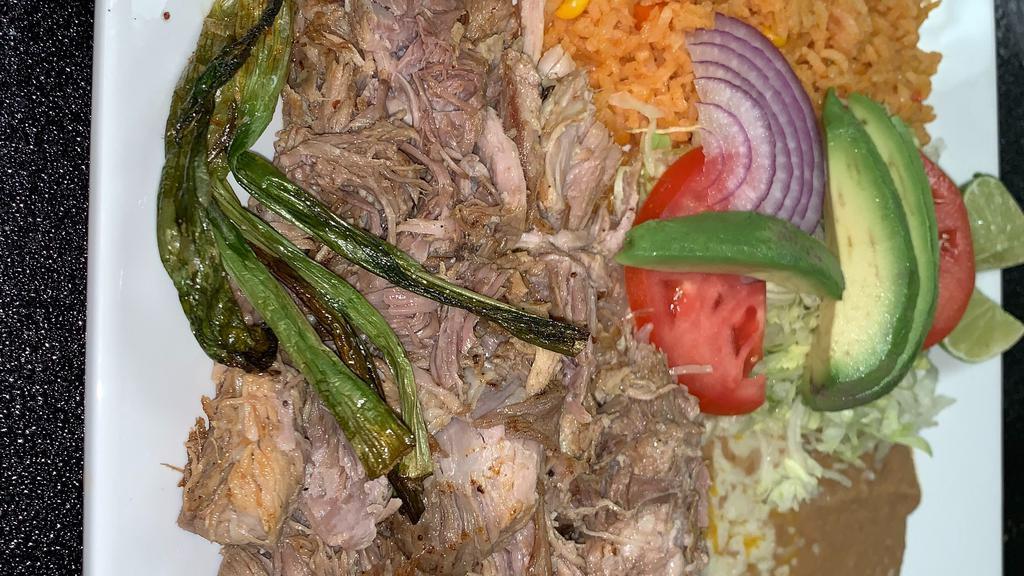 Carnitas · Tender chunks of roasted pork and grilled onions served with Mexican rice, refried beans, guacamole salad, pico de gallo and tortillas.