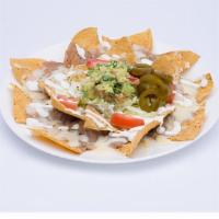 Nachos · Chips, beans, cheese dip, tomato, cilantro, jalapeño peppers, sour cream and guacamole. Add ...