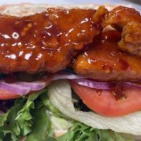 Vegan  Clucker Po-Boy · Tofu based tender, lettuce, onions, tomato, pickles, cucumber, vegan boon on a baguette
Choi...