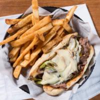 Philly Steak Sandwich · Loaded with flavor! Thinly-sliced roast beef topped with freshly grilled green peppers and o...