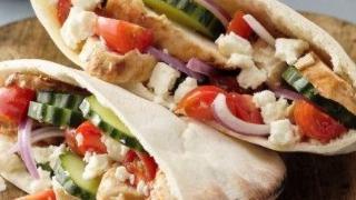 Grilled Chicken Pita Melt · Juicy Grilled Chicken breast strips  on a folded toasted Pita Bread with melted cheese and y...