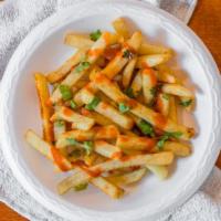 Masala Fries · Potato fries sprinkled with Indian spices and sriracha sauce to taste.