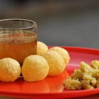 Pani Puri · Consists of round, hollow puris, fried crisp and filled with a mixture of flavored water (co...