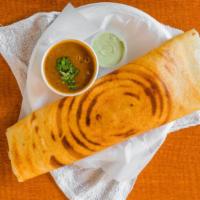 Masala Dosa · Crisp and crepe-like, made from rice, lentils, potato, and curry leaves, and served with chu...