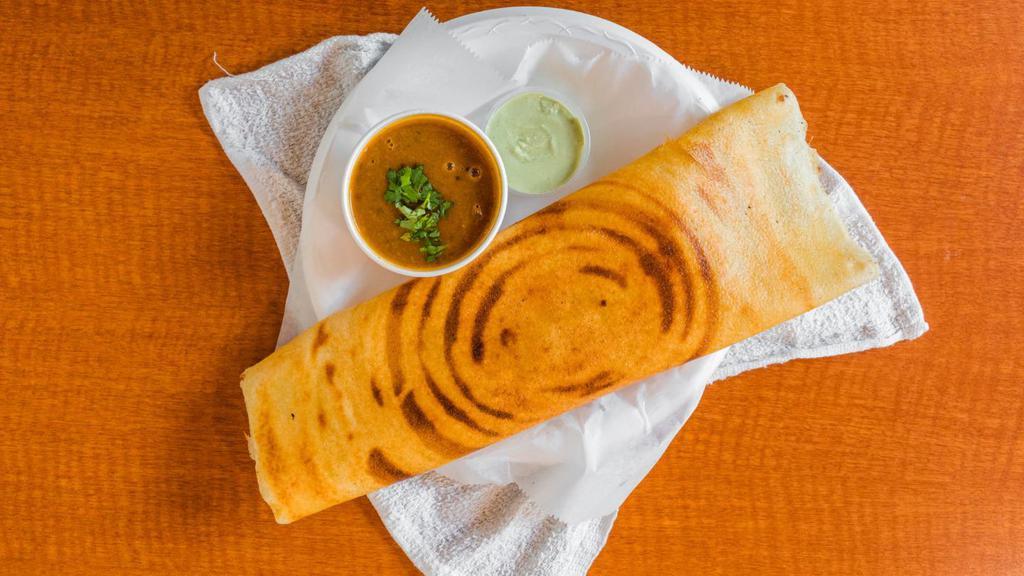 Masala Dosa · Crisp and crepe-like, made from rice, lentils, potato, and curry leaves, and served with chutneys and sambhar.