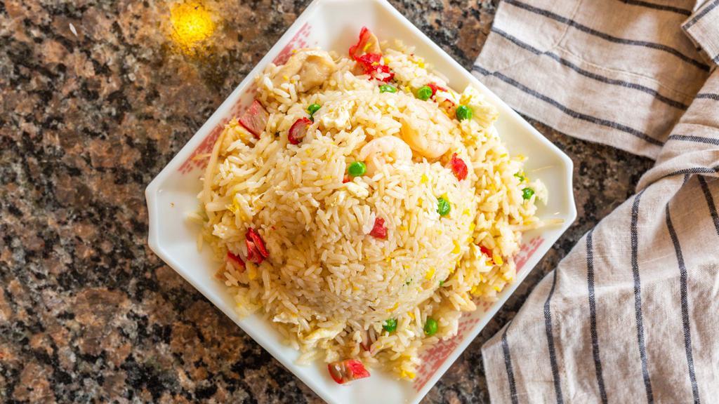 House Special Fried Rice · Combination of pork, chicken, beef, shrimp, bean sprouts, onions, peas and eggs. Made with traditional wok frying rice with onions and seasonings in soy sauce.