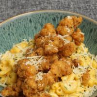 Fried Lobster Mac & Cheese  · Fried langistino lobster tail over creamy mac and cheese.