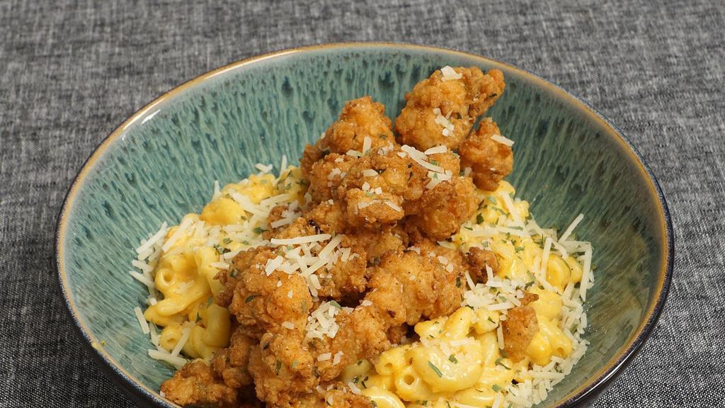 Fried Lobster Mac & Cheese  · Fried langistino lobster tail over creamy mac and cheese.