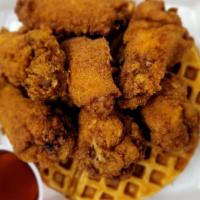 Classic Chicken And Waffles  · A delicious buttered waffle with 7 amazingly seasoned chicken wings with maple syrup.