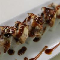 Dragon Roll · Eel and cucumber topped with avocado and caviar.