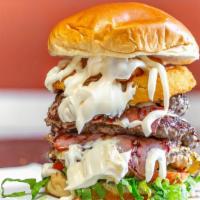 Moe'Z Beast Burger · Triple Beef Patty, Bacon, Onion Ring, Mozzarella Sticks, Lettuce, Tomatoes, Onions, Pickles,...