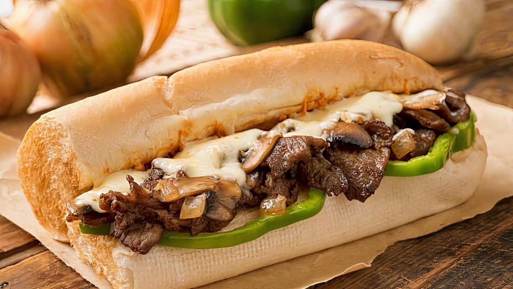 That Philly Tho! Brisket · Sautéed onions and garlic, banana peppers, baby bell peppers (none of those green), boss sauce, provolone, romaine, and tomato served on a Cellone's hoagie bun with a side of Italian aioli and a small fry.
