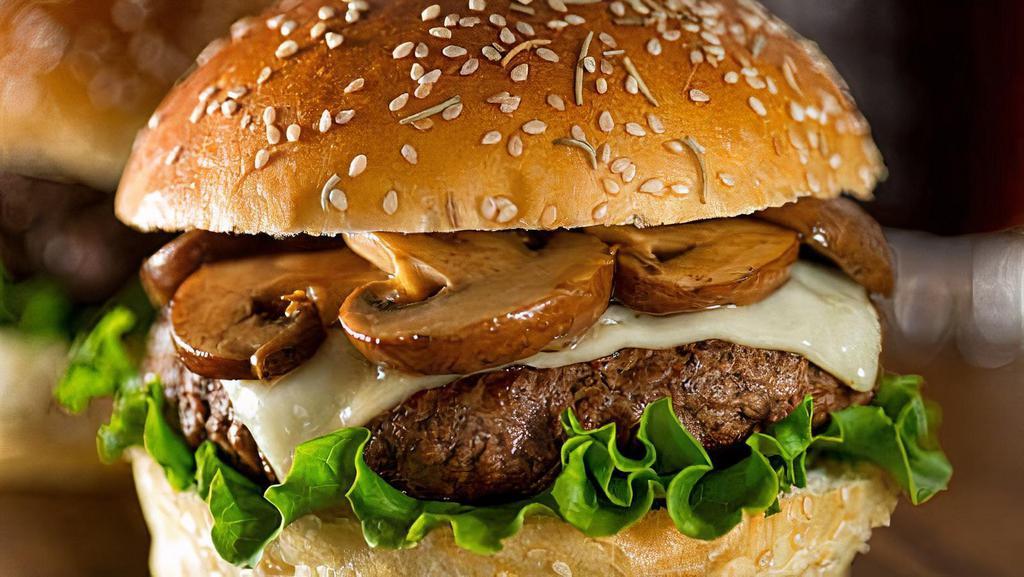 Mushroom Swiss · Single burger with sautéed onions and garlic, portobello mushrooms, lettuce, tomato, Swiss cheese and a small fry!