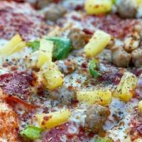 Pineapple Chicken Pizza · Our version of a pineapple pizza with pineapple, sliced chicken, and green peppers.