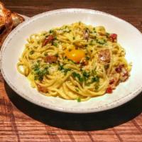 Carbonara · spaghetti, bacon, parmesan, romano, egg, chive.