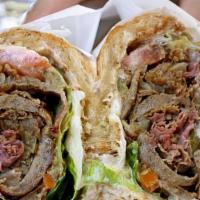 Italian Beef With Gyro Meat · Italian beef meat dipped and cheese  hot peppers with gyro meat and gyro sauce. Served with ...