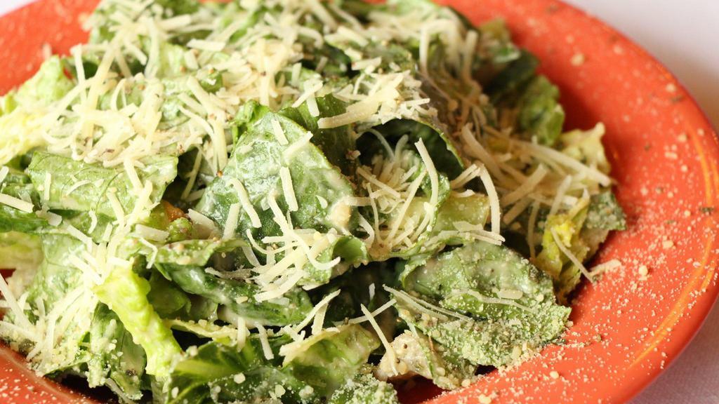 Caesar Salad · Iceberg/Romaine Mix, Shredded Parmesan, Croutons and Caesar Dressing.