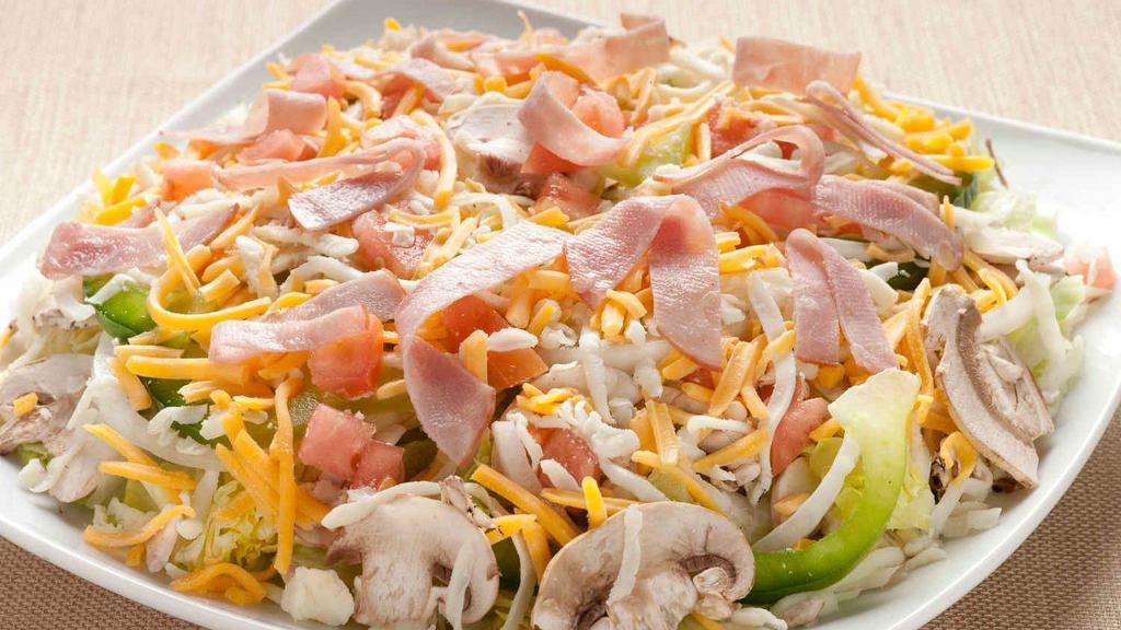 Supreme Salad · Iceberg/Romaine Lettuce Mix, Mushrooms, Onions, Green Peppers, Tomatoes, Mozzarella Cheese, Cheddar Cheese and Canadian Bacon.
