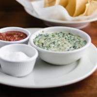 Cream Spinach Artichoke Dip · Spinach in a parmesan cream sauce. Served with warm tortilla chips and a side of fresh salsa.