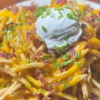 Loaded French Fries · Our french fries topped with cheddar cheese, jack cheese, bacon, green onion and sour cream