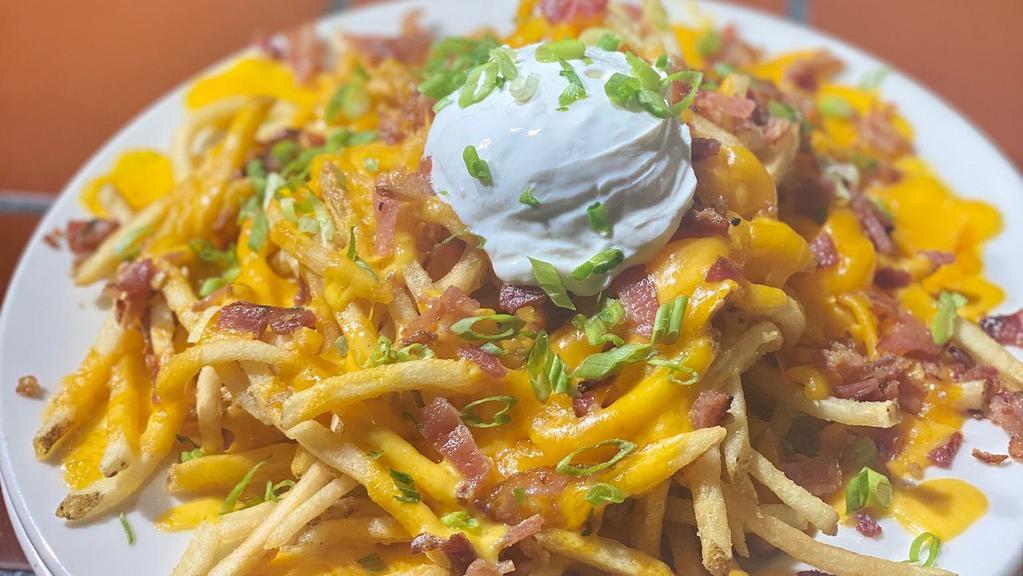 Loaded French Fries · Our french fries topped with cheddar cheese, jack cheese, bacon, green onion and sour cream