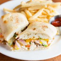 Chicken Ciabatta Sandwich · Peppers, onion, bacon, havarti cheese, chipotle mayonnaise. Served with your choice of one s...