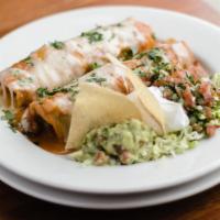 The Enchilada Plate · Corn tortilla filled with grilled chicken, Monterey jack, enchilada red sauce and sour cream...