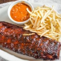 Barbeque Baby Back Ribs · Slow cooked, fall of the bone with your choice of two sides. Baked beans and french fries re...