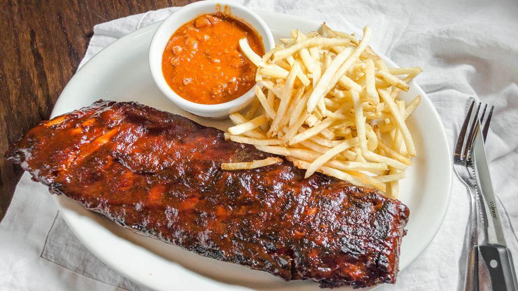 Barbeque Baby Back Ribs · Slow cooked, fall of the bone with your choice of two sides. Baked beans and french fries recommended.