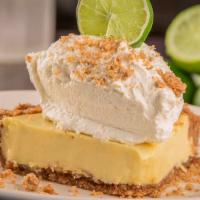Key Lime Pie · Graham cracker, walnut and pecan crust filled with natural key lime custard, topped with hom...