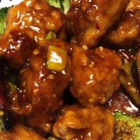 General Tso Chicken · Hot & spicy. Batter dark meat chicken in a spicy brown sauce with broccoli on the side.
