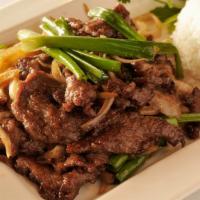 Mongolian Beef · Beef stir fry with green and white onion in a house soy sauce.