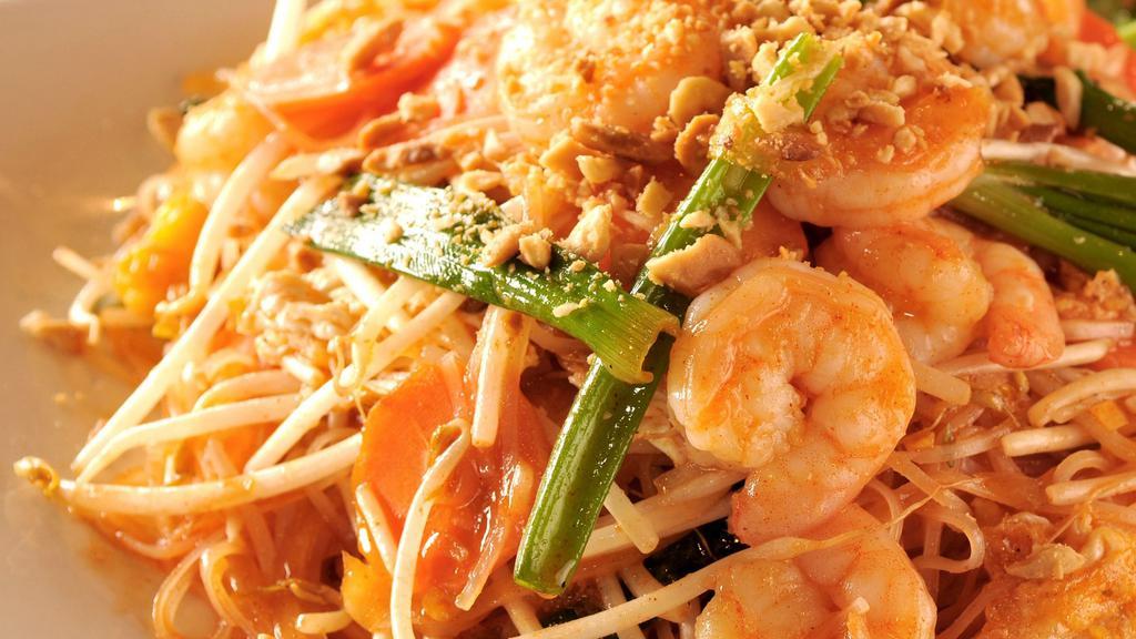 Shrimp Pad Thai · Hot & spicy. Shrimp stir fry with rice noodle, carrot and onion in a sweet and spicy red sauce.