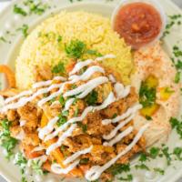 Chicken Shawarma Bowl · Chicken, pickles, mixed bell peppers, garlic, tomato blend, rice, hummus.