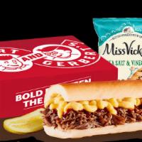 Box Lunch Neuron · A sandwich with Mac & Cheese and Beef Brisket, topped with Citrus Chipotle BBQ sauce that co...