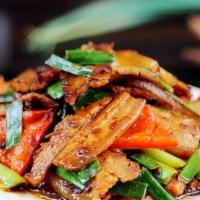 Double Cooked Pork · Spicy. (Sliced pork belly stir-fried with leeks, red pepper, white onion in chef special bro...