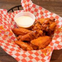 Wings · Eight chicken wings, tossed in your choice of sauce and served with your choice of dipping s...