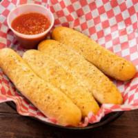 Soft Bread Sticks · Four soft bread sticks seasoned with our special garlic seasoning, topped with Romano cheese...