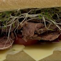 Roast Beast Sandwich · House-roasted beef with homemade horseradish cream sauce, Swiss, tomato, sprouts and red oni...