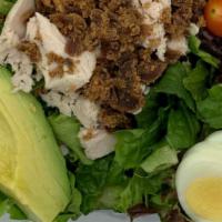 The Cobb Salad · Chicken breast, bacon, tomato, hard-cooked egg, bleu cheese and avocado on a bed of mixed gr...
