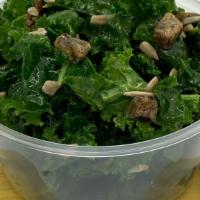 Kale Salad · Tender kale and chopped dates tossed in a homemade citrus vinaigrette and garnished with sun...