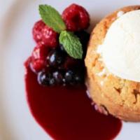 Warm Butter Cake · Fresh Berries, Vanilla Ice Cream, Raspberry Sauce
