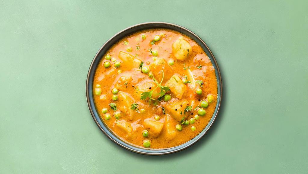 Potato & Green Peas (Vegan) · Peas and potatoes, simmered to perfection in an onion, tomato and Indian curry