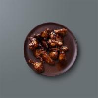 Classic Hot Wings · Wings tossed in our classic hot sauce that bring back memories.